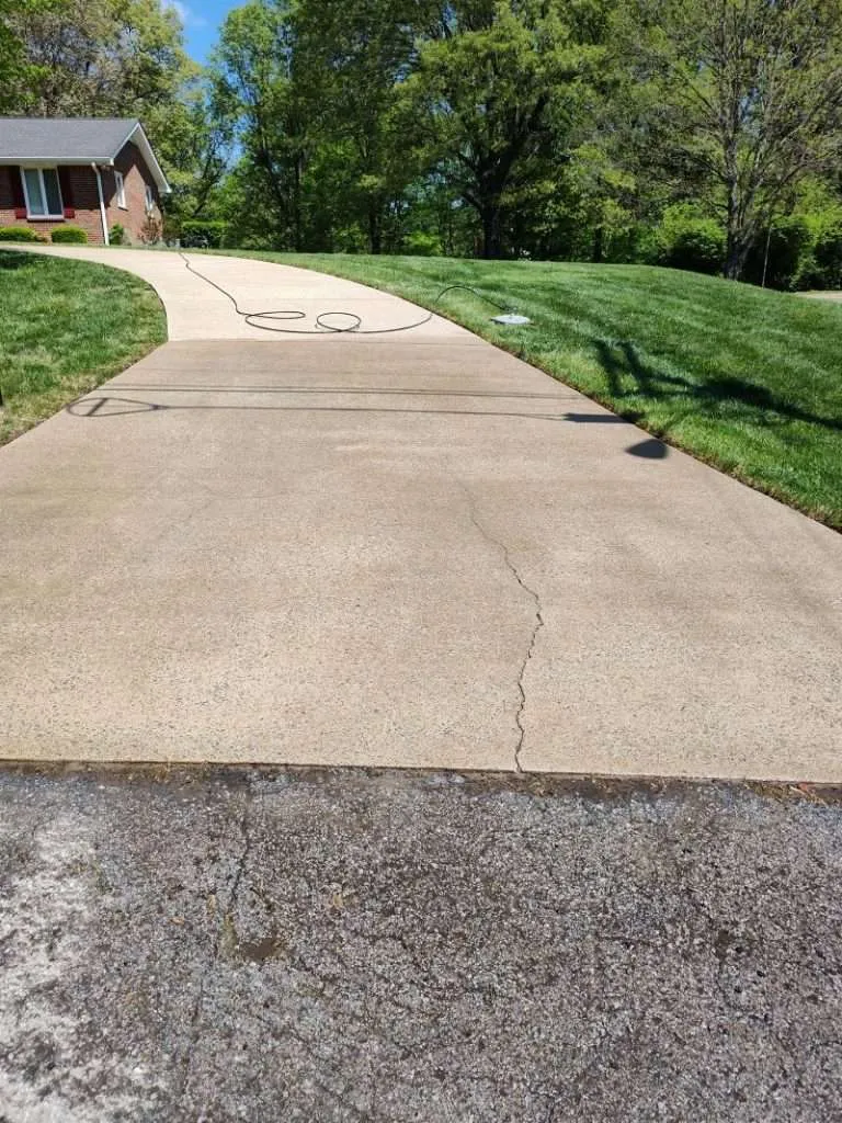 Concrete cleaning in Clarksville TN showing driveway after professional cleaning